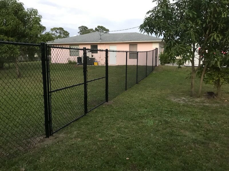 a picture of a black chain link fence